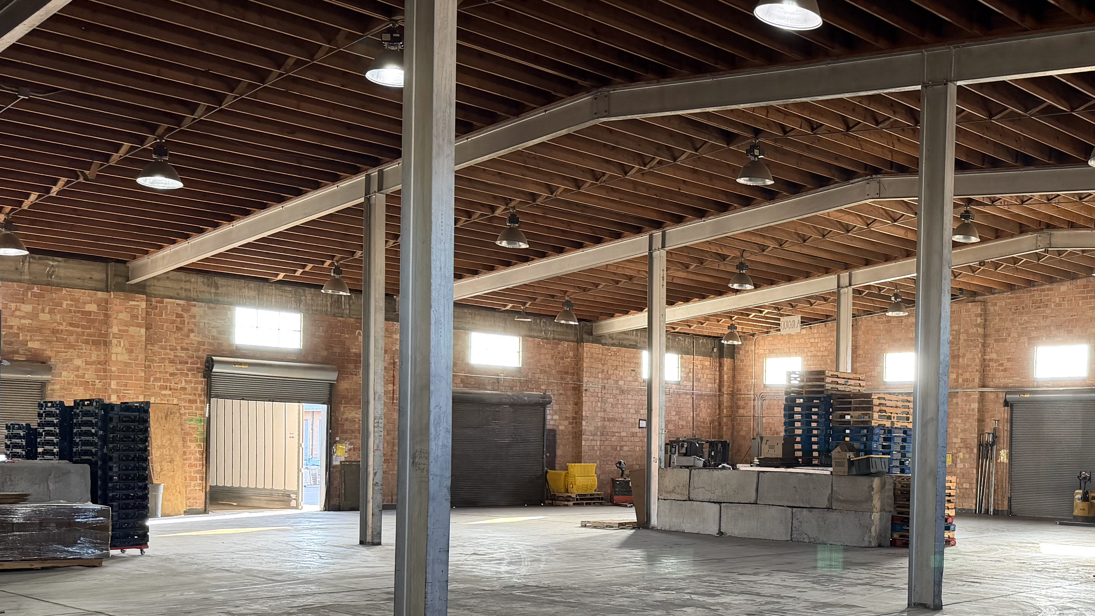Interior crossdock floor with pallet stacks and loading bays